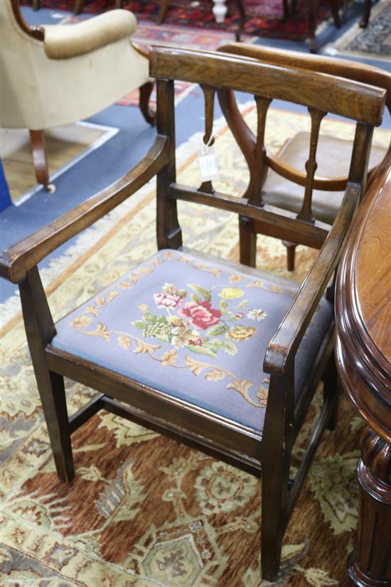 A set of five late George III mahogany dining chairs (one arm, for single), with floral tapestry seats